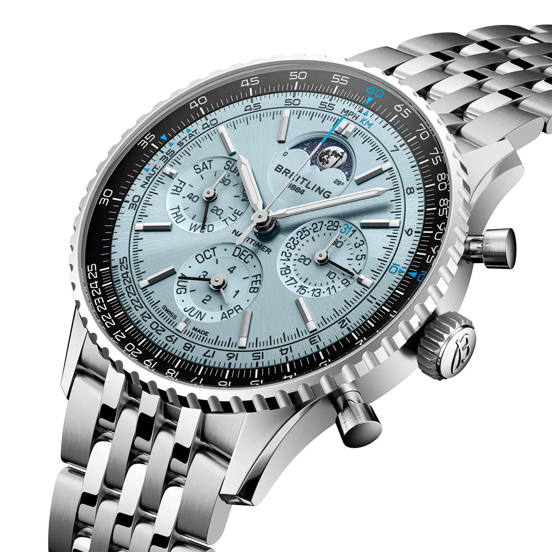 A close-up of the BREITLING Navitimer B19 Chronograph 43 Perpetual Calendar by Breitling, featuring a silver metal band, light blue dial, multiple subdials for day, date, month, and a moon phase window—an exquisite luxury watch.