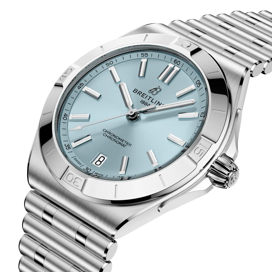A close-up of the Breitling Chronomat B31 Automatic 40, featuring a light blue dial, silver hour markers and hands, date window at 6 o’clock, stainless steel bezel, and a silver metal link bracelet.