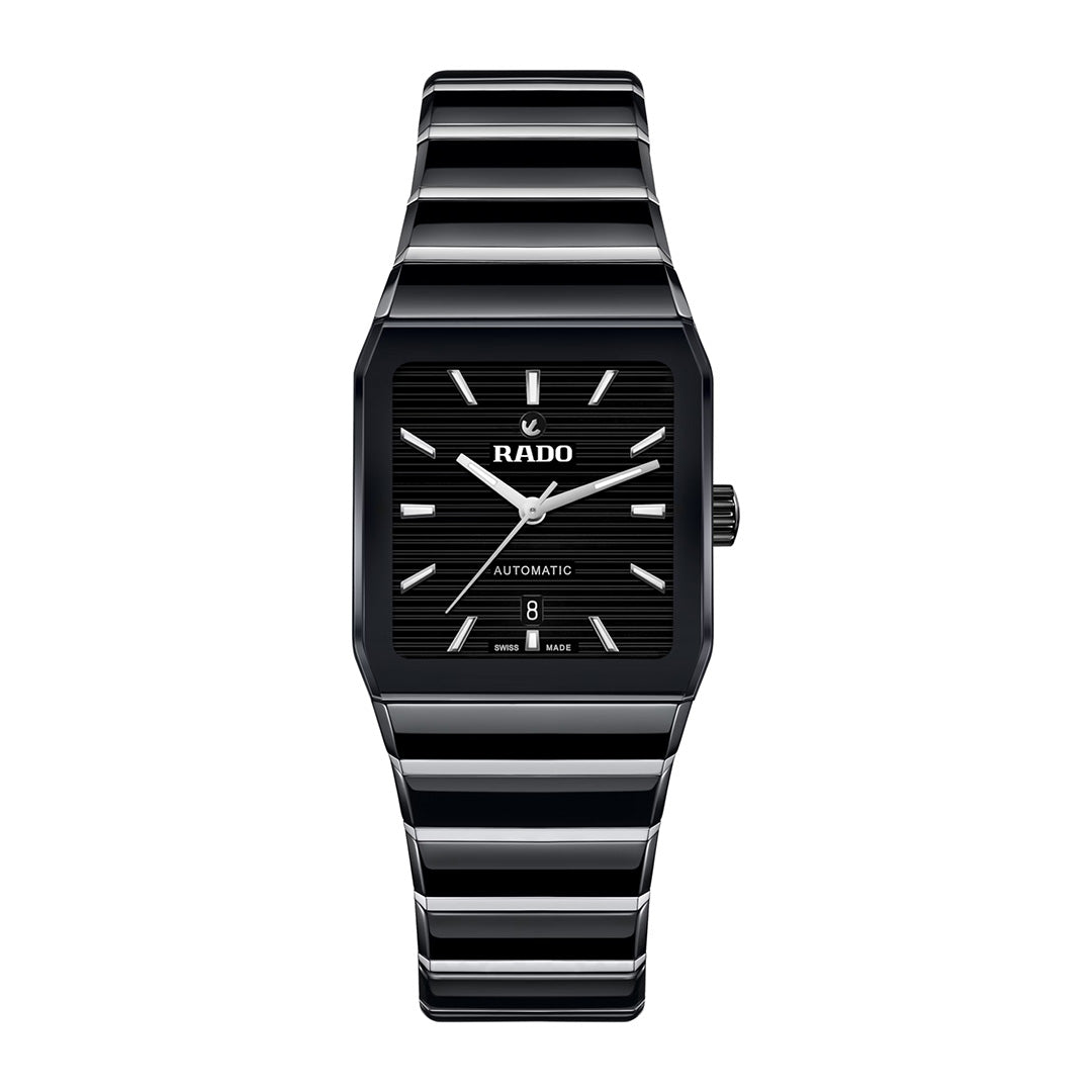 A RADO Anatom Automatic 27.5mm watch featuring a black rectangular face with silver hour markers and a striped black high-tech ceramic metal band. This automatic timepiece displays the date at the 6 o’clock position and bears the “Automatic” label.