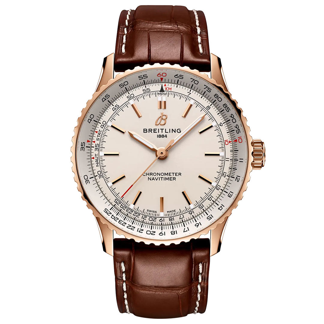 The Breitling Navitimer Automatic 41 features a brown leather strap, gold case, and a white dial adorned with detailed markings, including a chronometer scale and red accents. The Breitling logo and "1884" appear below 12 o’clock on this iconic automatic GMT timepiece.