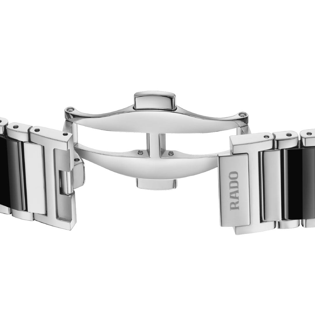Close-up of the RADO Integral Diamonds Quartz 31.5mm watch's stainless steel bracelet with deployment clasp, partially open to reveal the secure locking mechanism and engraved "RADO" logo, showcasing Swiss quartz precision.