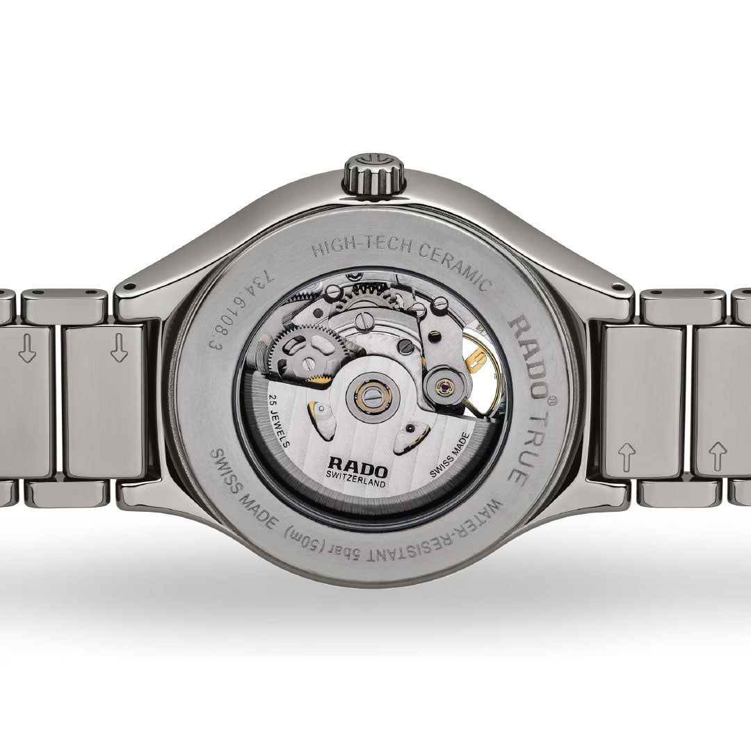 Back view of the RADO True Round Secret Diamonds Automatic 40mm Watch displaying its Swiss-made movement, engraved details, and stainless steel bracelet. "High-Tech Ceramic" and "Swiss Made" appear near the edge.