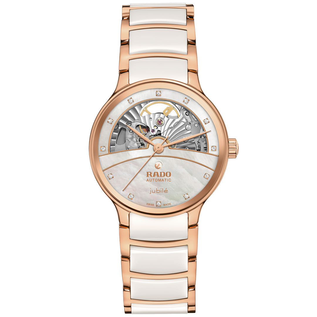 The RADO Centrix Automatic Diamonds Open Hearts 35mm Watch features a rose-gold PVD stainless steel and white ceramic band, a partially open skeleton dial with diamond hour markers, and visible intricate gears at the top.