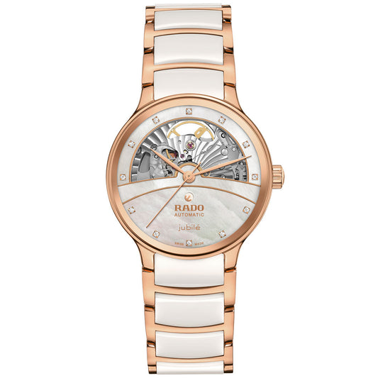 The RADO Centrix Automatic Diamonds Open Hearts 35mm Watch features a rose-gold PVD stainless steel and white ceramic band, a partially open skeleton dial with diamond hour markers, and visible intricate gears at the top.