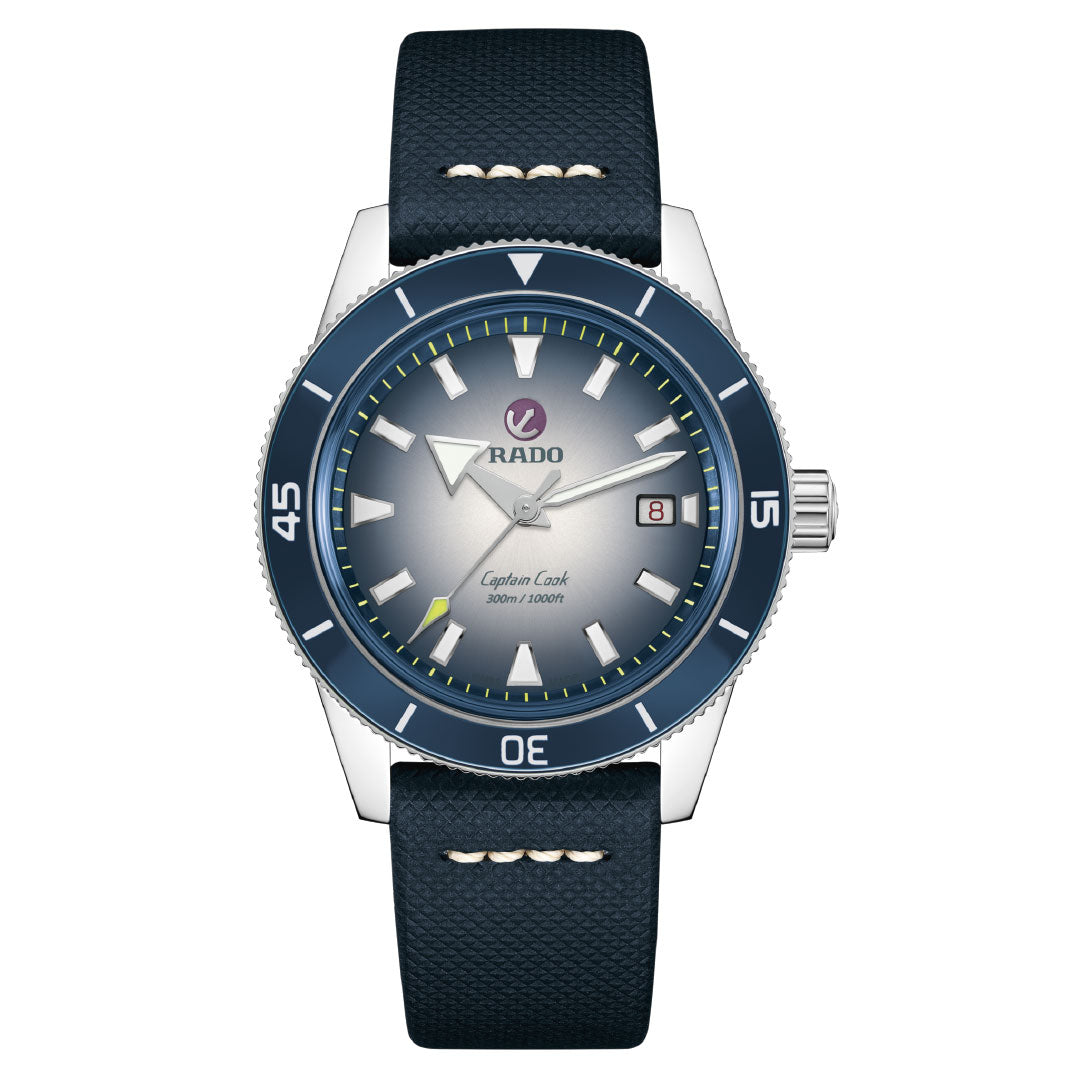 The RADO Captain Cook Automatic 42mm Watch features a blue bezel, blue leather strap, silver case, gradient blue dial, 80-hour power reserve, date at 3 o'clock, and bold hour markers. The watch is shown set to 10:10.