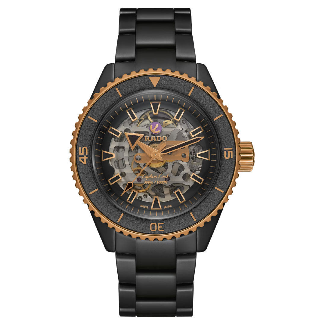 The RADO Captain Cook High-Tech Ceramic Skeleton Automatic 43mm Watch features a black and gold skeleton dial with Nivachron hairspring, gold bezel and crown accents, and a black metal bracelet.