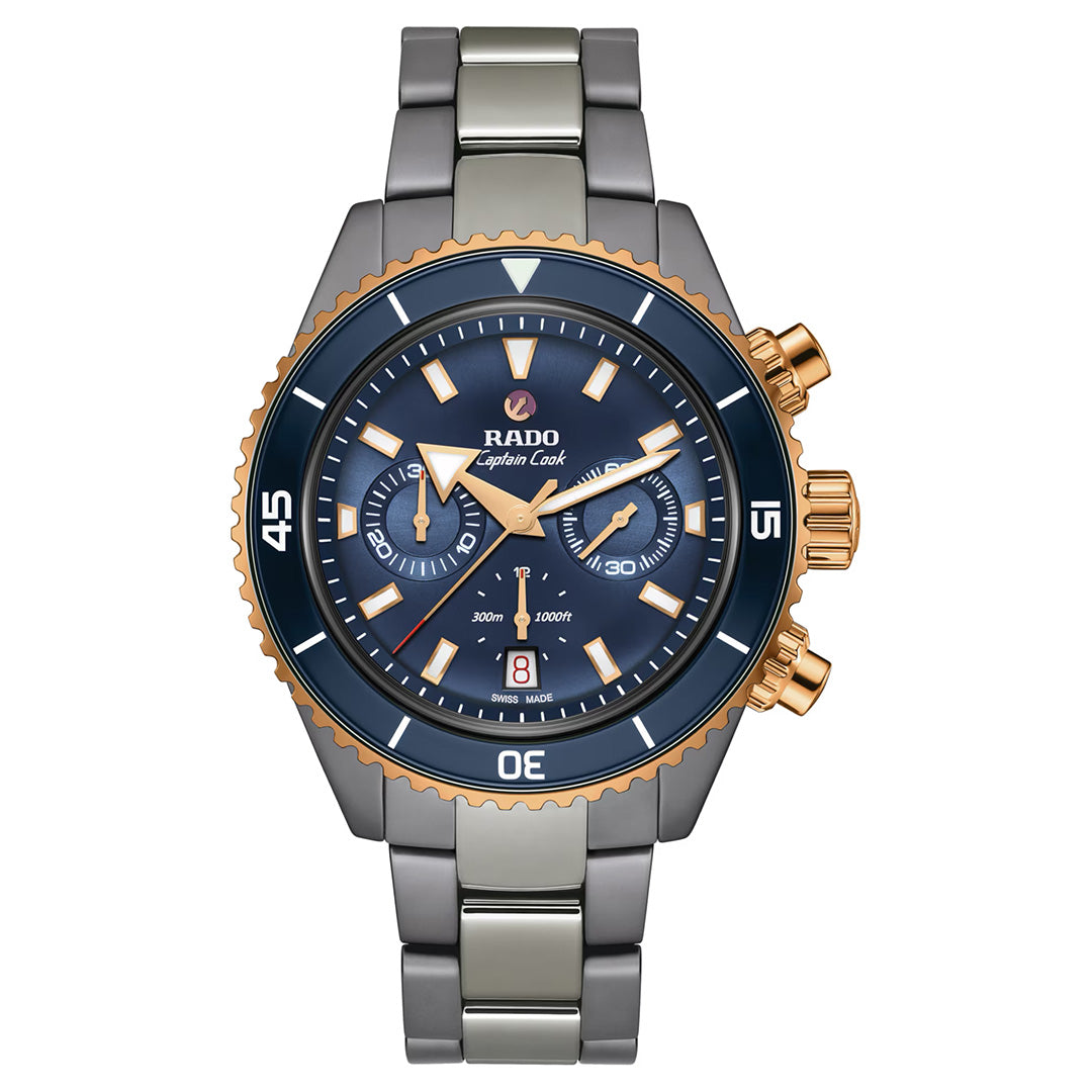 The RADO Captain Cook Hi-Tech Ceramic Chronograph Automatic 43mm Watch features a sleek metallic band, a striking blue face with gold accents, three subdials, bold hour markers, and a convenient date display at the 6 o’clock position.