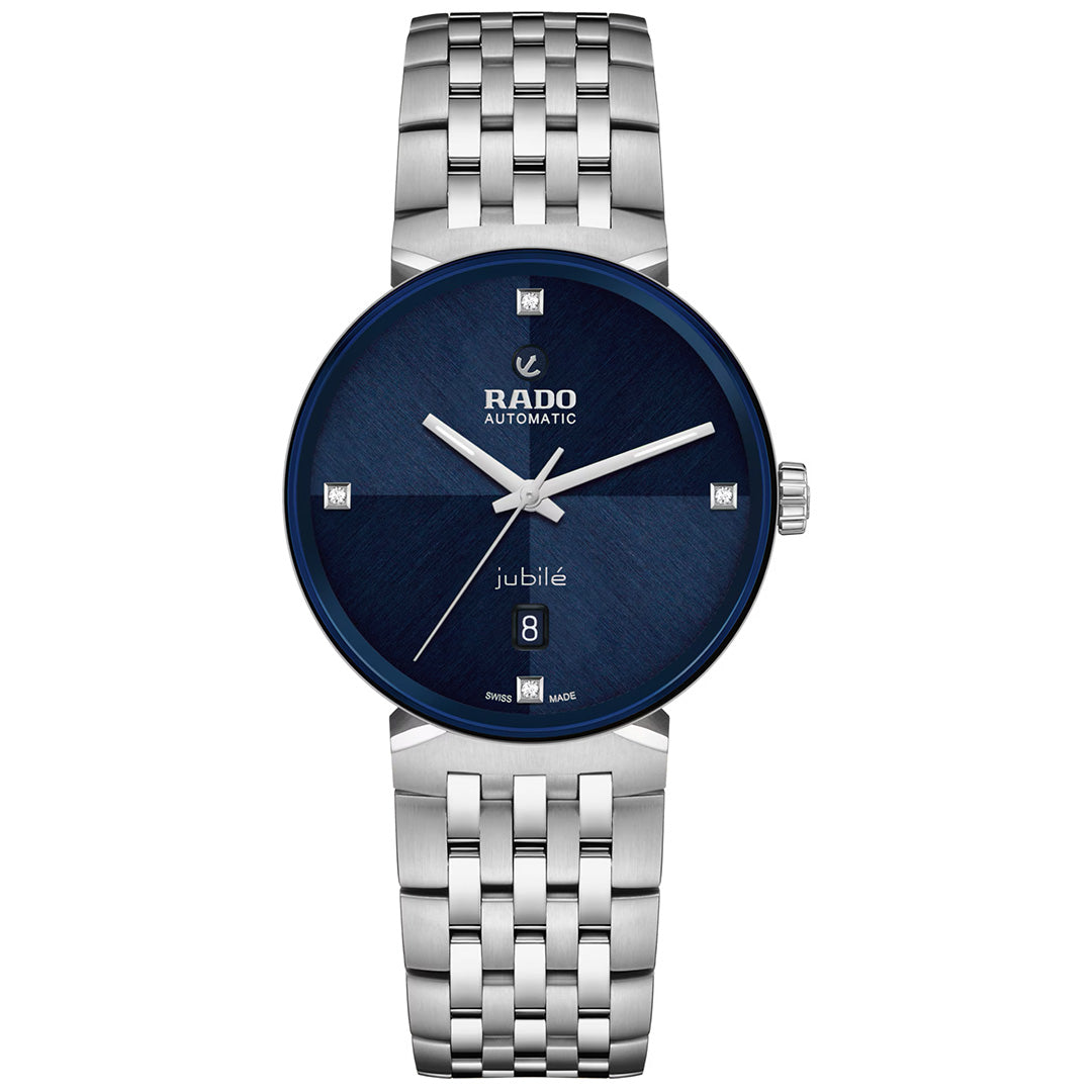 The RADO Florence Automatic 39mm Watch is a Swiss-made timepiece featuring a silver metal link band and a dark blue round dial. It offers a date display at the 6 o’clock position and four diamond hour markers at 3, 6, 9, and 12 o’clock. Crafted with a durable sapphire crystal, this elegant watch reflects the refined design of the RADO Florence collection.