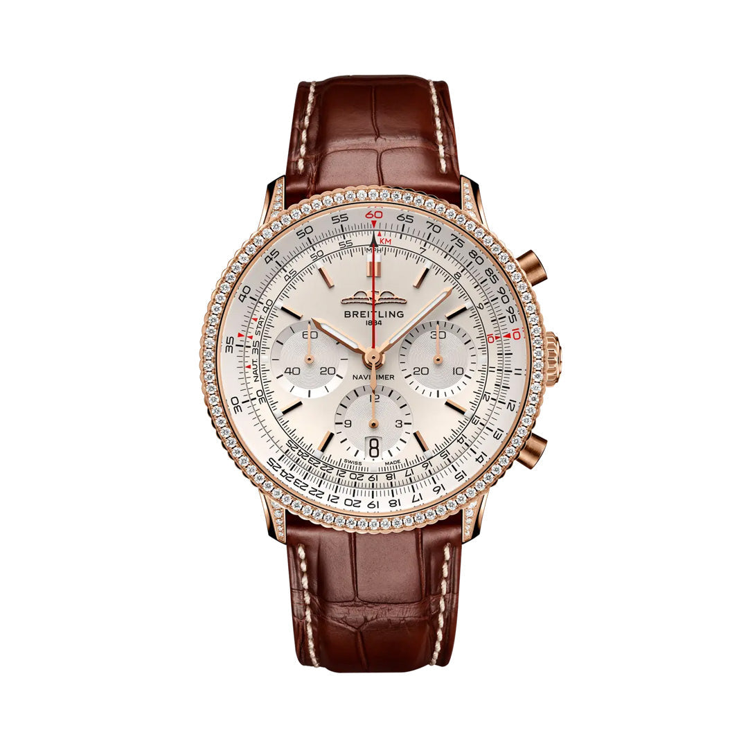 Introducing the BREITLING Navitimer B01 Chronograph 41 by Breitling—a luxurious aviation watch featuring a brown leather strap, gold case, diamond bezel, silver dial with multiple subdials, and a distinctive red-tipped second hand. This exquisite pilot’s chronograph is crafted for those who value precision and timeless style.