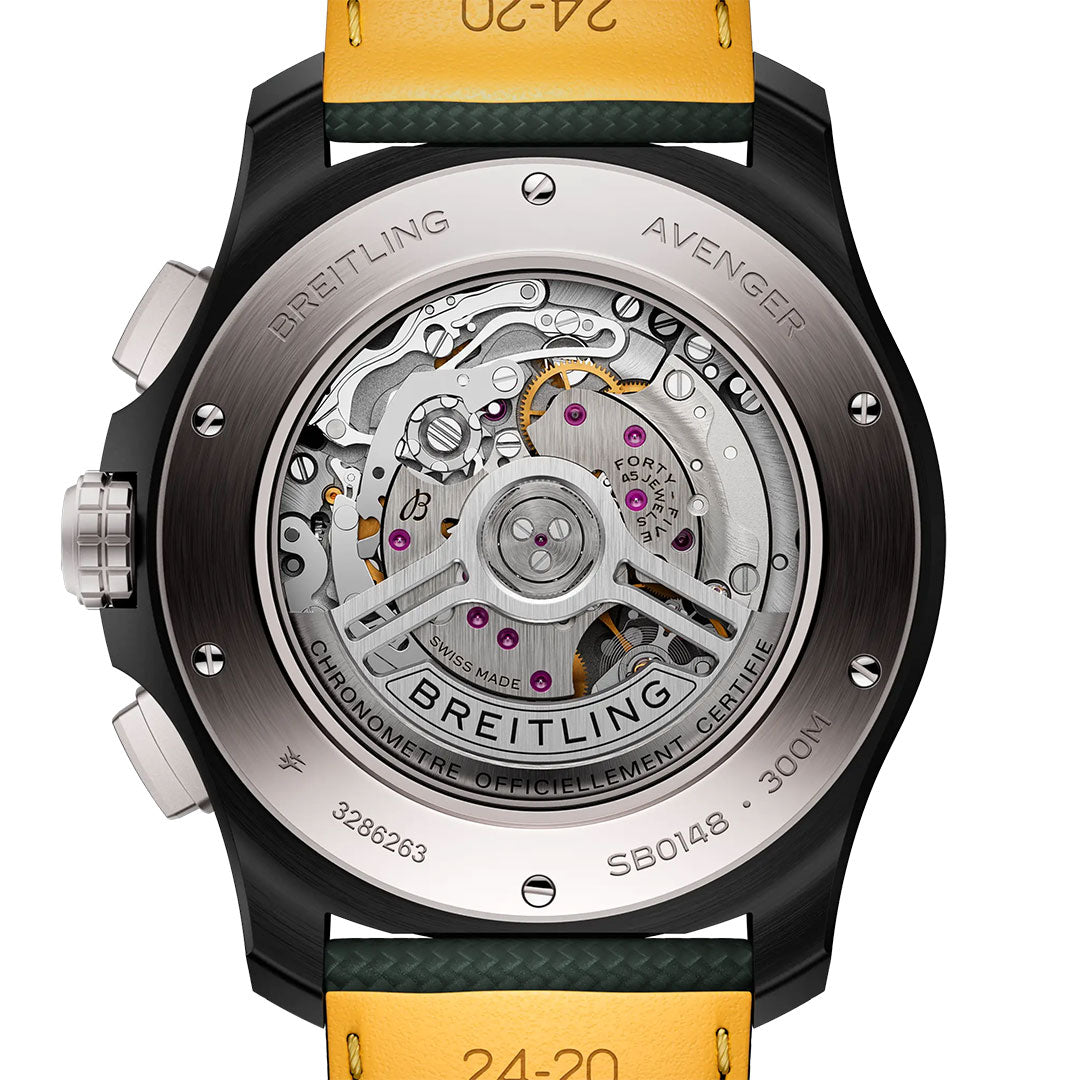 The back of the BREITLING Avenger B01 Chronograph 46 Night Mission reveals its mechanical movement through a clear caseback, features engraved text, and has a yellow strap visible—capturing signature Breitling aviation style.