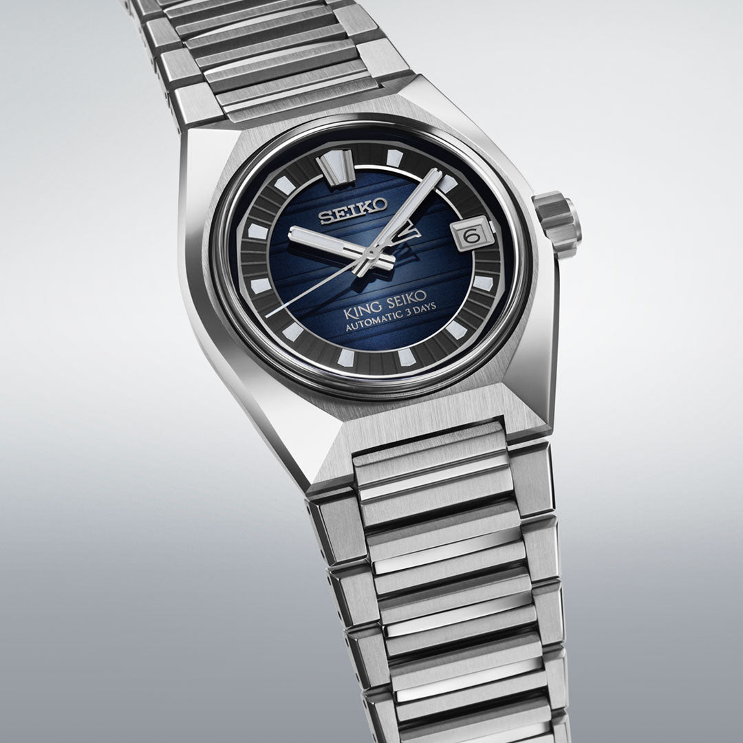 A close-up of the Seiko King Seiko Vanac Automatic with Manual Winding 41mm Watch, featuring a metallic strap, blue dial, silver hour markers and hands, date window at 3 o’clock, and "King Seiko Automatic 3 Days" on the face.