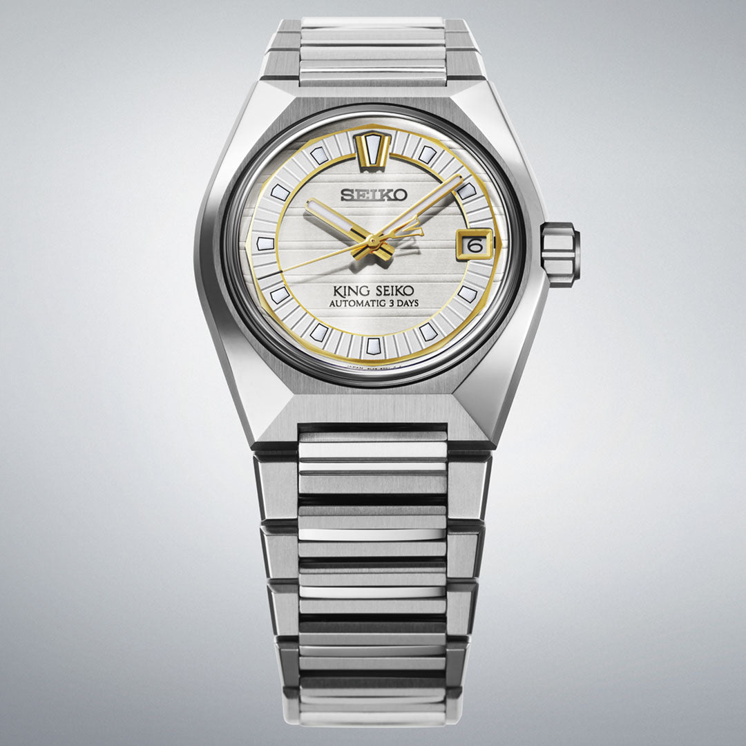 A Seiko King Seiko Vanac Automatic with Manual Winding 41mm watch featuring a silver metallic band, white dial, gold accents, and date display at 3 o’clock. The watch face reads "King Seiko Automatic 3 Days." Set against a light gray background.