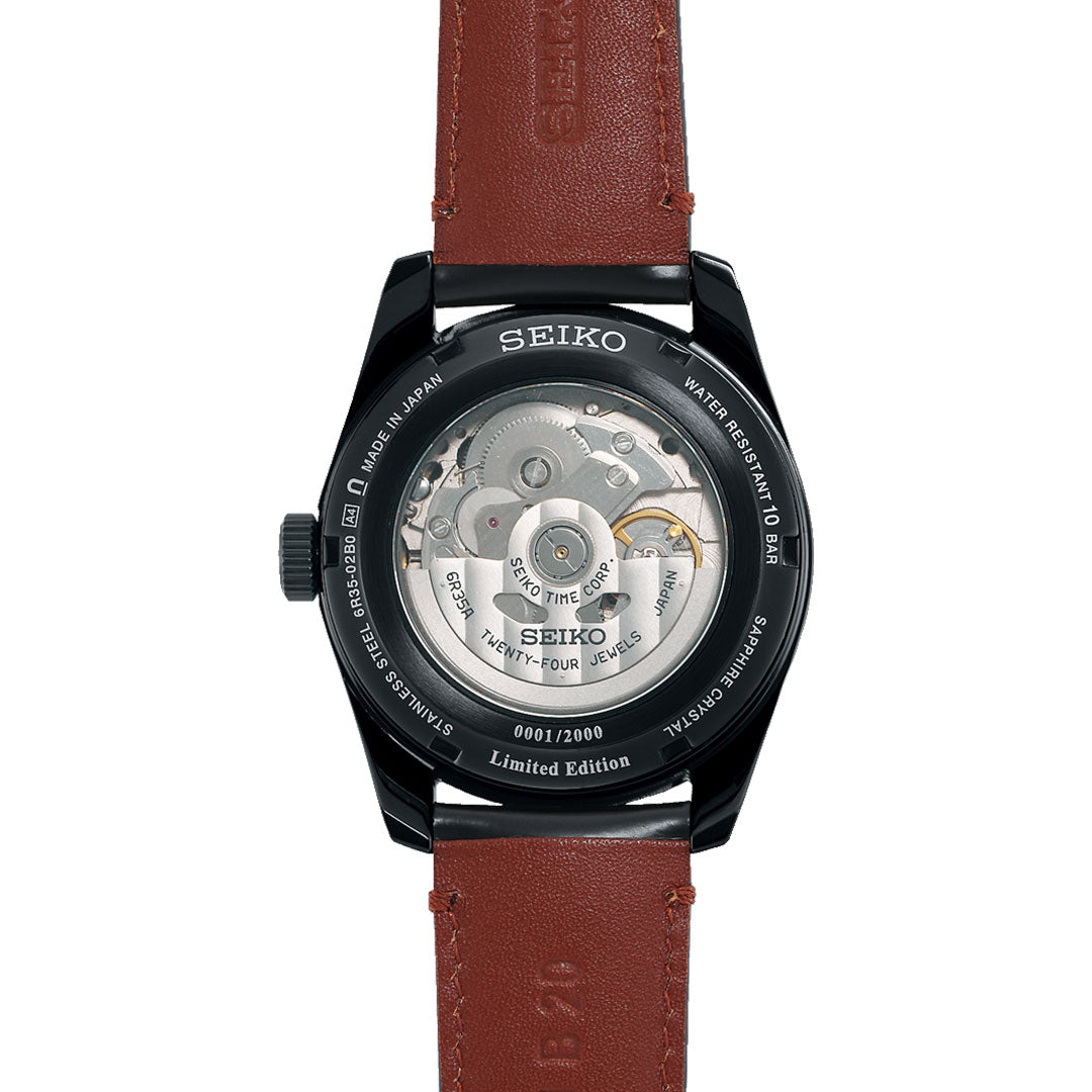 Back view of the Seiko Presage Sharp Edged Series Kabuki-Inspired Automatic 39mm watch, limited to 2,000 pieces, featuring a brown leather strap and see-through case back revealing the movement and internal gears.