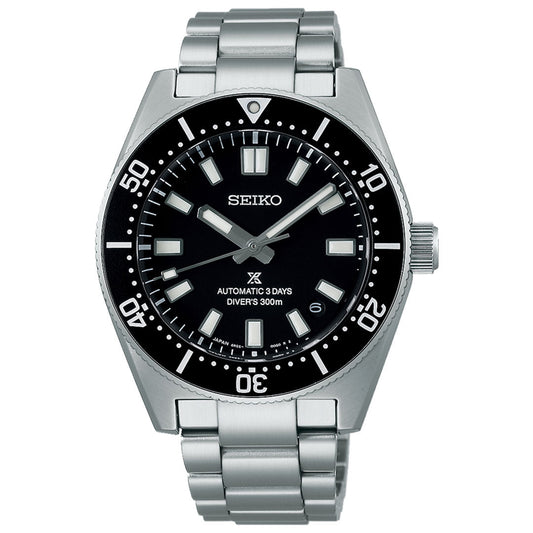 The Seiko Prospex Sea 1965 Heritage Diver's Automatic With Manual Winding 40mm Watch is a stainless steel timepiece designed for divers. It features a black dial with a rotating bezel, prominent luminous hour markers, and a date window at the 3 o'clock position. The dial is marked with "Automatic 3 Days Diver's 300m," reflecting its durable automatic movement.