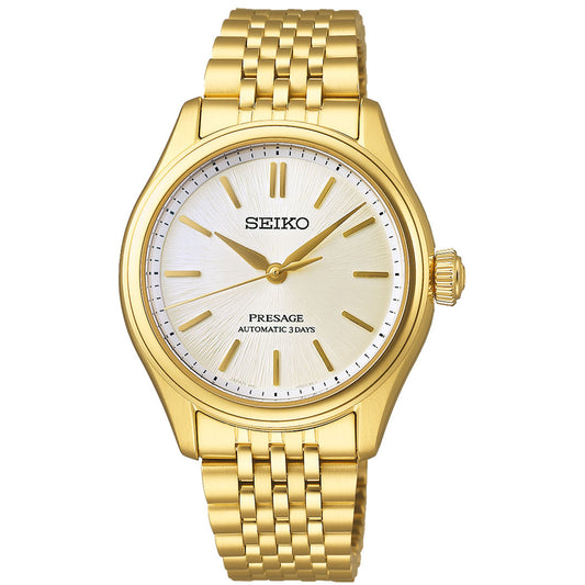 The Seiko Presage Classic Series Automatic With Manual Winding 41mm Watch features a gold case, round white dial, gold hour markers and hands, and a multi-link gold bracelet. No date display or additional complications.