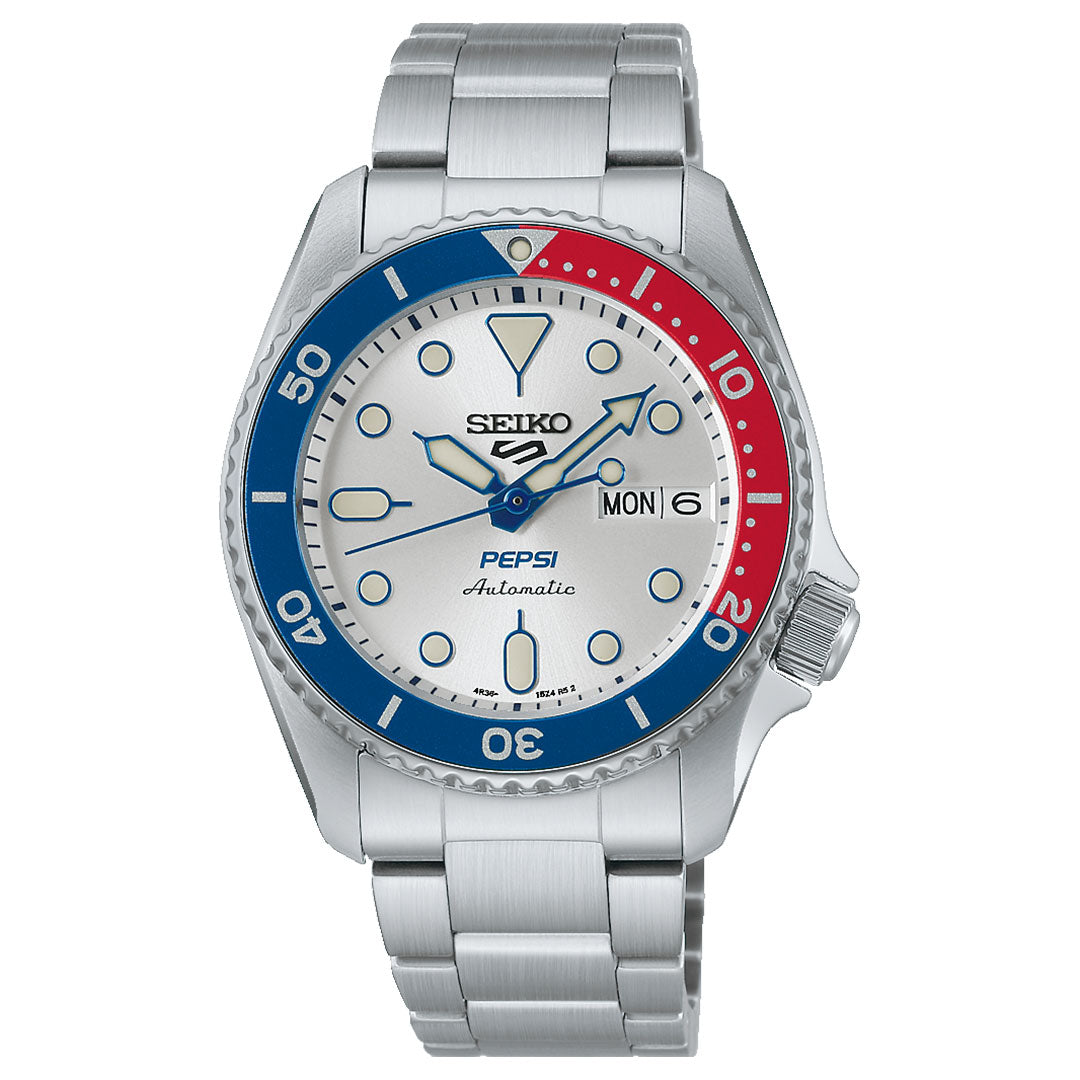 The Seiko 5 Sports SKX Series Pepsi Automatic 38mm Watch is a limited edition of 7,000 pieces, featuring a silver bracelet, silver dial with day-date display, luminous markers and hands, and a signature blue and red "Pepsi" bezel.