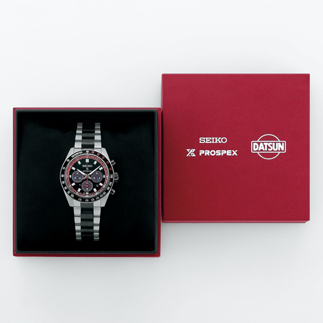 A Seiko Prospex Speedtimer Datsun 240Z Solar 41.4mm Limited Edition watch (4,000 pieces) with a black and silver strap sits in a red box next to its lid, featuring Seiko, Prospex, and Datsun logos in white.