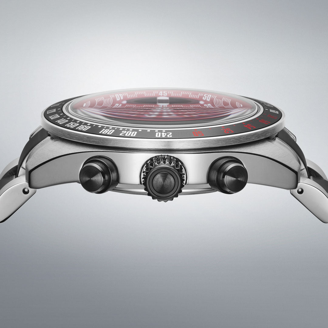 A close-up side view of the Seiko Prospex Speedtimer Datsun 240Z Solar 41.4mm Limited Edition watch, featuring a stainless steel case, black crown and pushers, and a red dial on a plain light gray background.