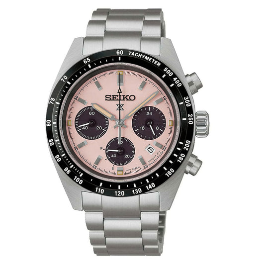 The Seiko Prospex Speedtimer Solar Chronograph 39mm Watch features a pink dial with three black subdials, date window, black tachymeter bezel, silver metal bracelet, and prominent side pushers.