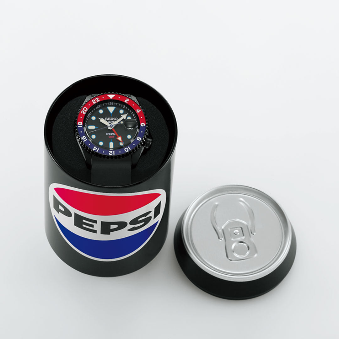 The Seiko 5 Sports SKX Series Pepsi Automatic 42.5mm Watch, Limited Edition of 7,000 pieces, is shown in a cylindrical black case with a Pepsi logo and can-style lid beside it, all set against a white background.