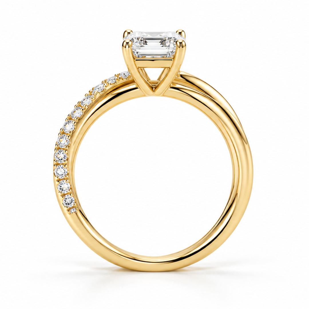 Raffi&Co.® 14K Yellow Gold 1.78 ct Round Lab Grown Diamond Crossover Engagement Ring featuring a rectangular center stone and small diamonds set along one side of the pavé crossover band.