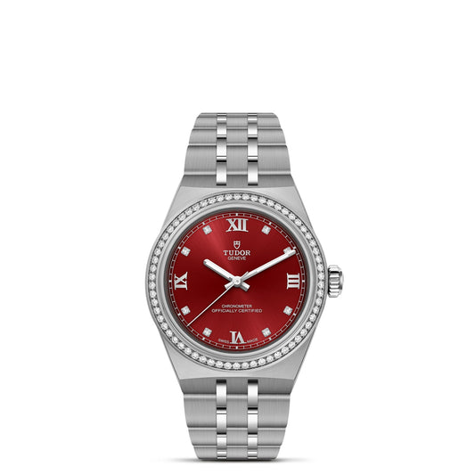 The TUDOR Royal is a stainless steel wristwatch with a red Roman numeral dial, diamond bezel, and metal link bracelet. This sport-chic watch displays the TUDOR logo and "Chronometer Officially Certified" on the face.