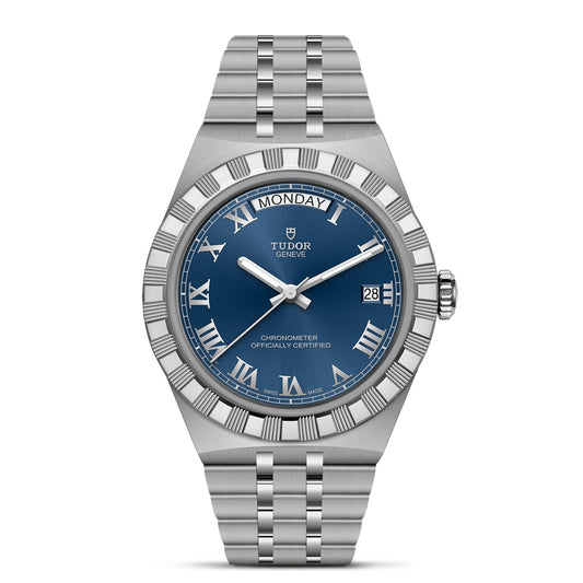 The TUDOR Royal by TUDOR is a silver wristwatch with a blue Roman numeral dial, day at 12, date at 3, and stainless steel bracelet—ideal for lovers of automatic sport-chic style.
