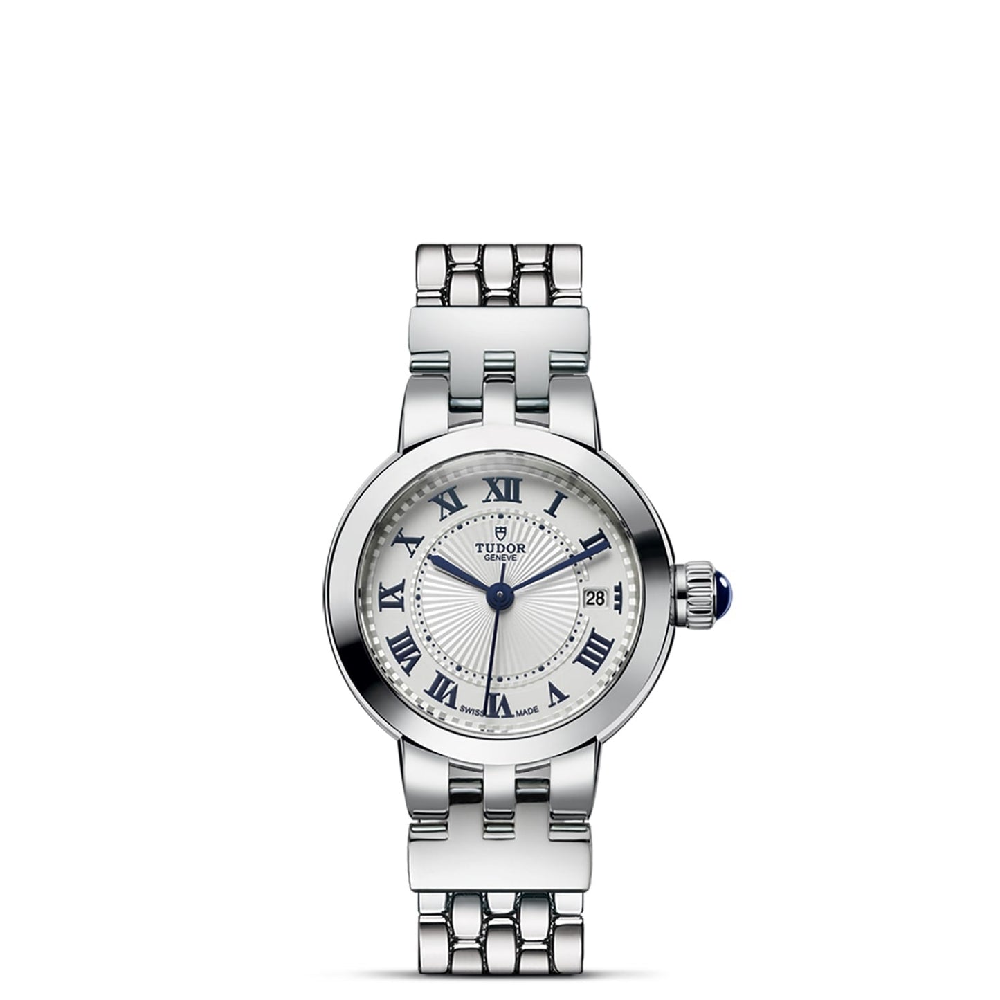 The TUDOR Clair de Rose is a silver wristwatch with a round opaline dial, blue lacquered Roman numerals, date window at 3 o'clock, blue hands, metal link bracelet, and a crown with a striking blue accent.