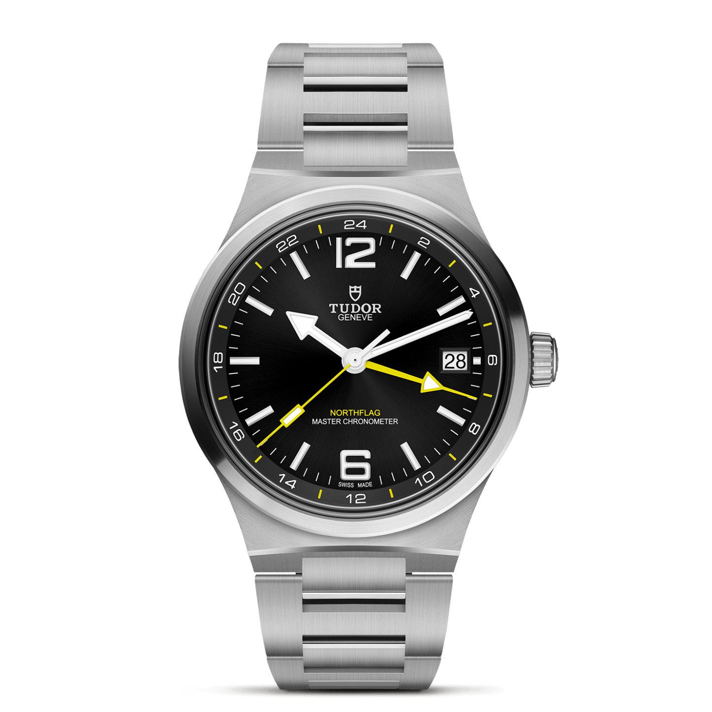 A TUDOR North Flag stainless steel wristwatch featuring a black dial, yellow GMT hand, date window at 3 o’clock, silver-tone indices, and a brushed metal bracelet exemplifies the brand’s spirit of precision—all presented against a white backdrop.