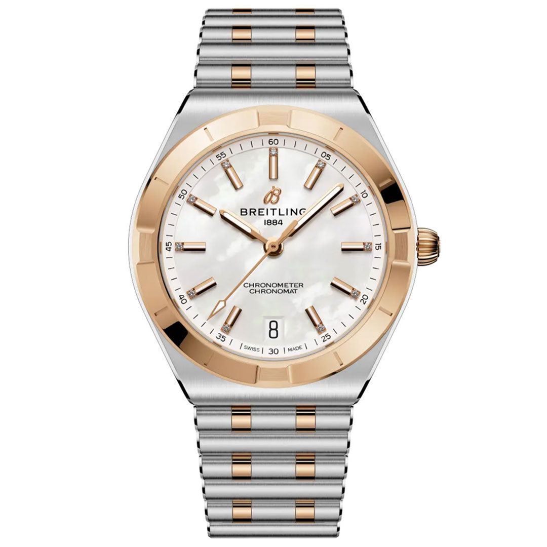 The BREITLING Chronomat Automatic 36 is a luxury wristwatch with a silver and gold-tone metal band, white mother-of-pearl dial, gold accents, COSC-certified automatic movement, and date display at 6 o’clock. "Breitling 1884" shown on the face.