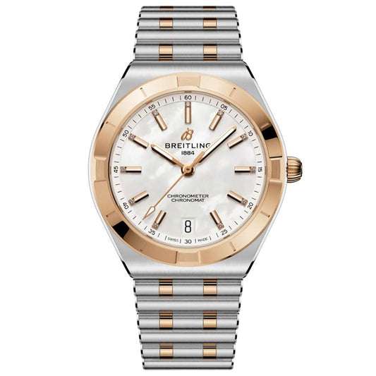 The BREITLING Chronomat Automatic 36 is a luxury wristwatch with a silver and gold-tone metal band, white mother-of-pearl dial, gold accents, COSC-certified automatic movement, and date display at 6 o’clock. "Breitling 1884" shown on the face.