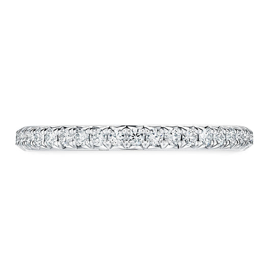 The Hearts On Fire Vela Platinum Round Brilliant Diamond Anniversary Ring is a delicate and refined band adorned with small round diamonds, forming a seamless sparkle.