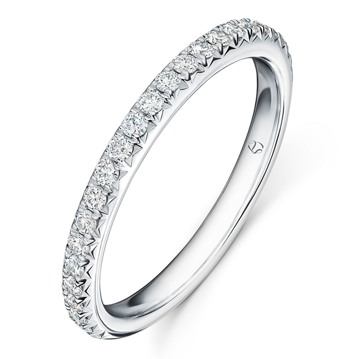 A platinum anniversary ring from Hearts on Fire features a series of small, round brilliant diamonds set along the band. The ring boasts a minimalistic and elegant design, with a smooth polish and subtle engraving inside, reminiscent of the stunning Vela collection.