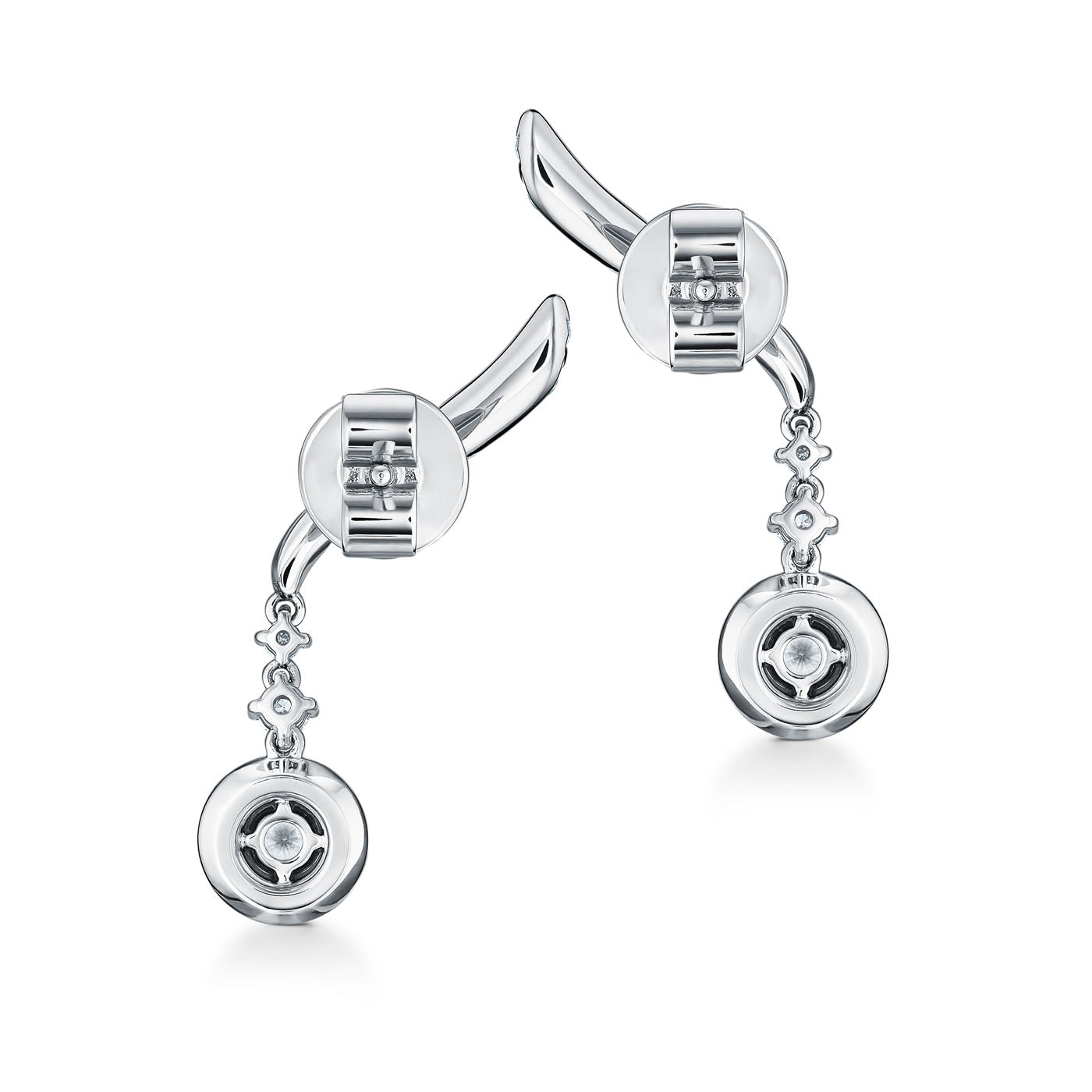 A pair of Hearts On Fire Vela 18K White Gold Drop Earrings with elegant dangling circular and floral designs, embellished with small, sparkling stones. These earrings boast a modern and sophisticated appearance, complete with a unique curvature at the top, making them a standout piece in any fine jewelry collection by Hearts on Fire.