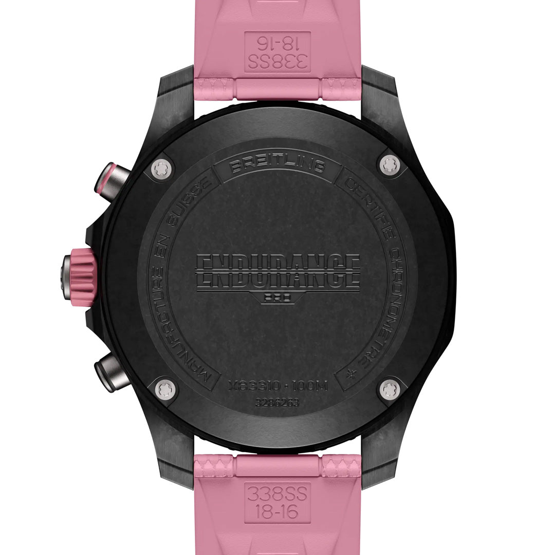 Back view of the BREITLING Endurance Pro 38 with a Breitlight® case and pink strap. "BREITLING" and "ENDURANCE" are engraved prominently on the back, with additional detailed engravings around the edges.