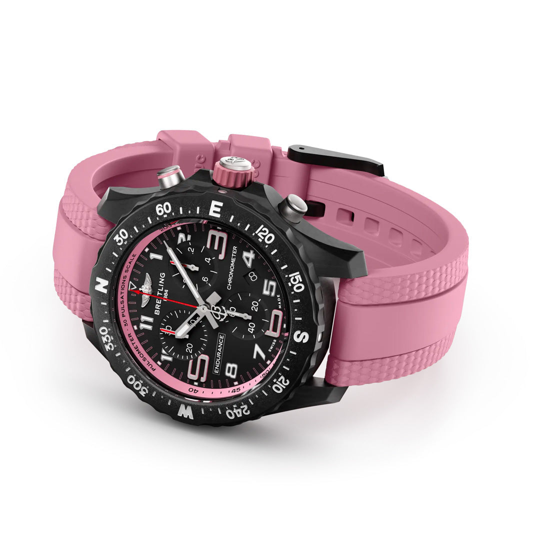 Discover the BREITLING Endurance Pro 38, an athleisure watch from Breitling blending style and function. It features a durable Breitlight® case, sporty black and pink theme, textured pink strap, bold numeral markers, detailed black dial with white/pink accents, three subdials, and date display.