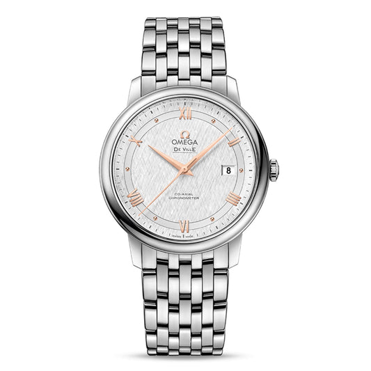An OMEGA De Ville Prestige Co-Axial Chronometer 39.5mm watch in silver, showcasing a textured white dial with rose gold Roman numerals and hands. It includes a date display at the 3 o'clock position and is complemented by a stainless-steel bracelet. This timepiece is driven by the exceptional precision of the OMEGA Co-Axial Chronometer Calibre 2500.