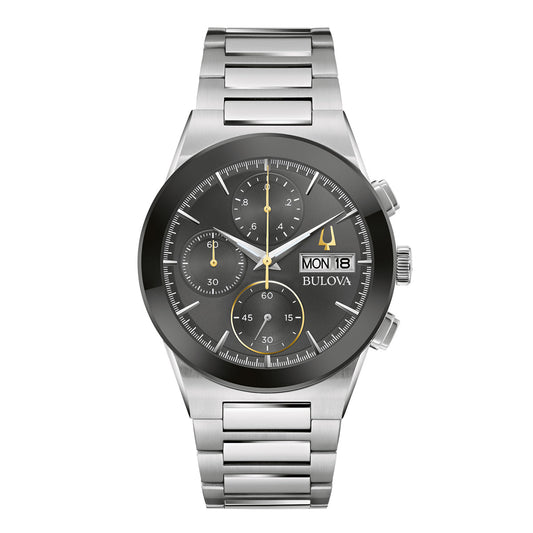 The Bulova Millennia Quartz 41mm Watch from Bulova boasts a stylish silver stainless steel bracelet, a dark round face with three sub-dials, and a digital display for the day and date. Its polished band enhances the sophisticated modernity of this exceptional chronograph timepiece.