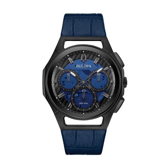 The Bulova CURV HPQ Quartz 44mm Watch features a sophisticated black case paired with a blue dial and blue leather strap. It includes three subdials, silver-toned hour markers, and high-performance quartz movement, highlighted by the iconic Bulova logo and an engraved "262 kHz.