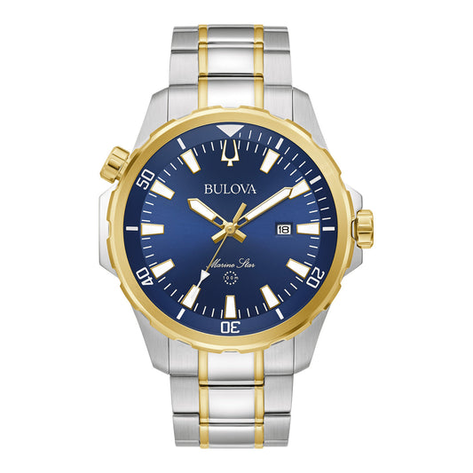 Discover the refined luxury of the Bulova Marine Star Series B Quartz 43mm Watch, a sophisticated men's timepiece from Bulova. It features a striking silver and gold metal band paired with an eye-catching blue face. This elegant watch is enhanced with gold accents, three hands, a date display, and a textured bezel adorned with minute indicators. Crafted from premium materials for lasting allure.