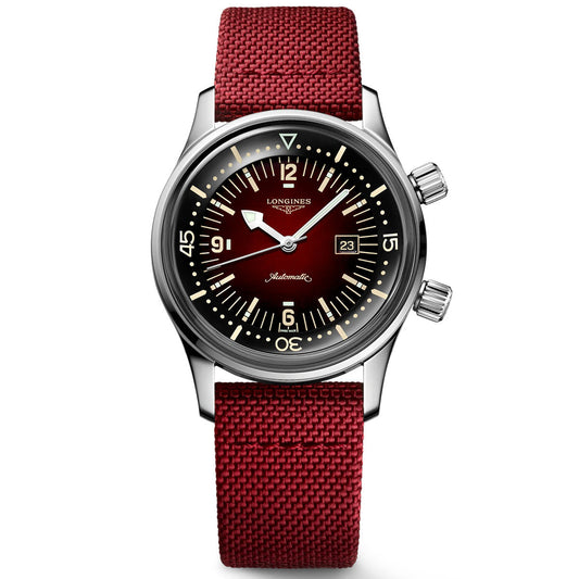 The Longines Legend Diver Automatic 36mm Watch showcases a maroon dial and coordinating fabric strap. Its timeless elegance is highlighted by luminous hour markers and hands, a date window at 3 o'clock, dual crowns on the right side, and a silver case.