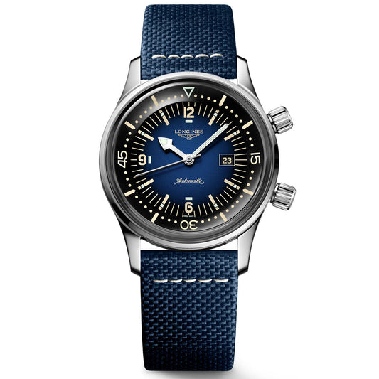 A stylish wristwatch from Longines, the Legend Diver Automatic 36mm Watch features a striking blue textured strap, a round stainless steel case, and a blue dial. It includes luminescent hands, a date display, and a unidirectional bezel with minute markers. The brand logo is prominently displayed on the dial.