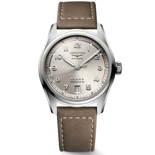 The Longines Spirit Automatic 37mm Watch by Longines is a silver wristwatch with a round face featuring Arabic numerals, a date window at 3 o'clock, and a brown leather strap. Inspired by aviation's golden era, it showcases a five-star design and the "Chronometer" inscription, all powered by its self-winding mechanical movement.