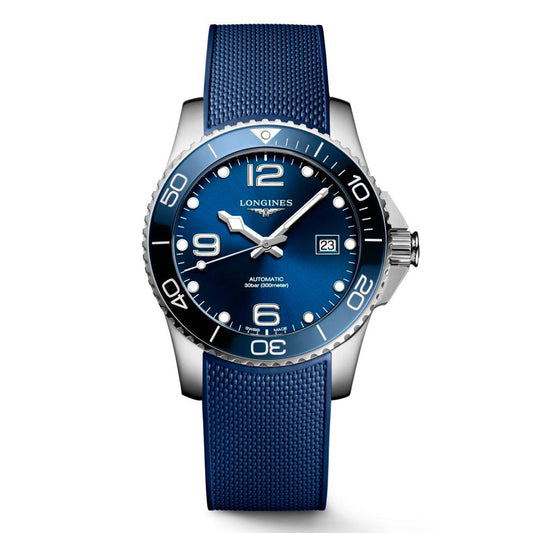 This Longines HydroConquest Automatic 41mm Watch from the Longines brand showcases a silver wristwatch with a blue face and bezel, featuring large white numerals. As part of the HydroConquest series from the Longines Sport Collection, it offers a date window, luminous markers, a textured blue strap, and minute indications on the bezel.