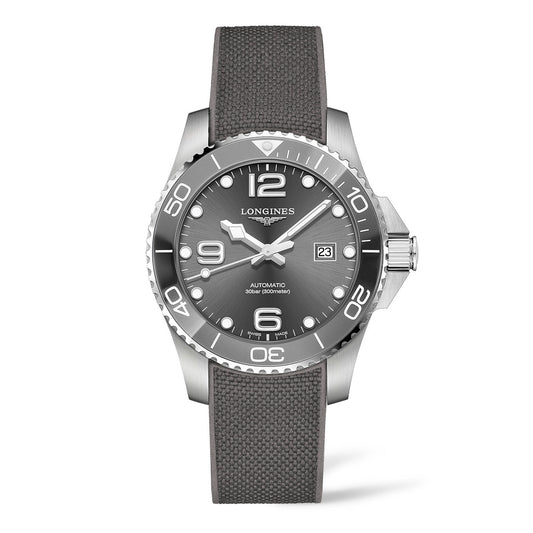 The Longines HydroConquest Automatic 43mm Watch boasts a silver wristwatch design with a gray textured strap. Its round face features silver hour markers and hands set against a sleek gray background, prominently displaying the brand name "Longines" and including a date window at the three o'clock position, enhancing the watch's high-performance appeal.